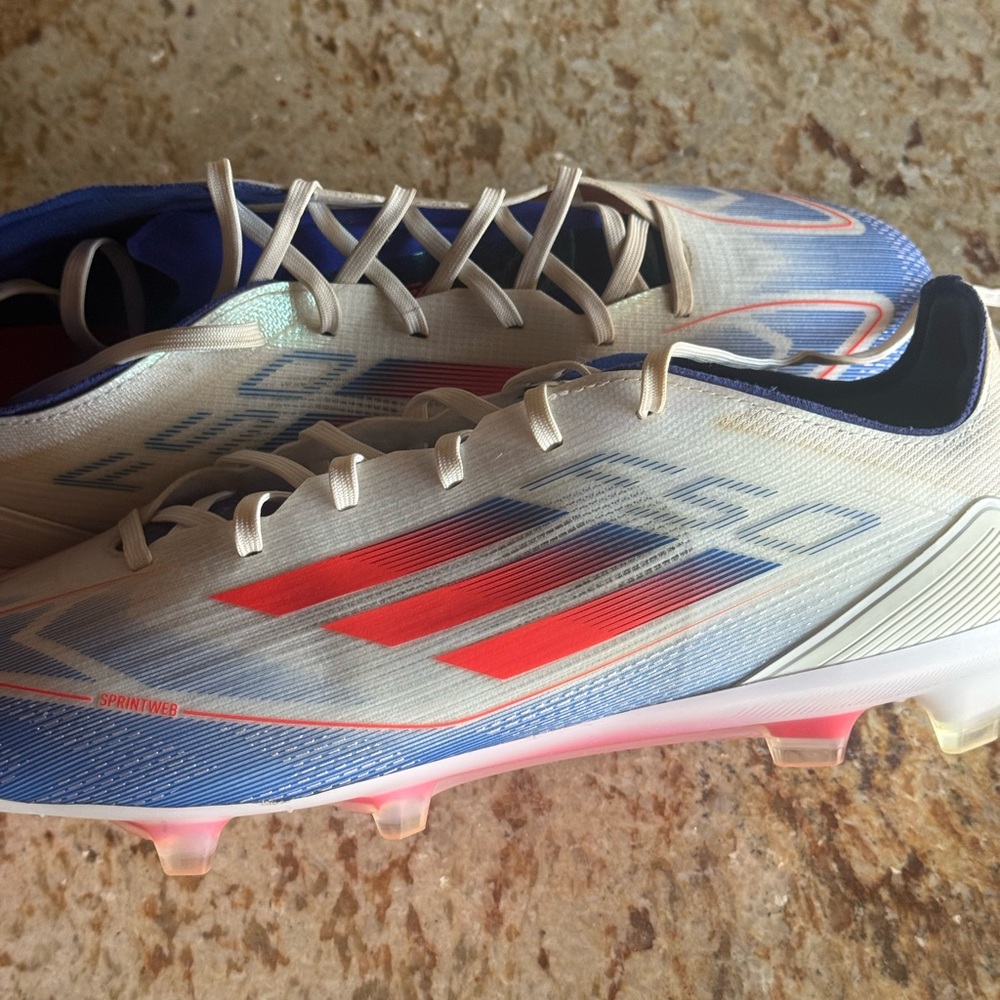 Adidas soccer Cleats with Red and Blue Highlights Messi